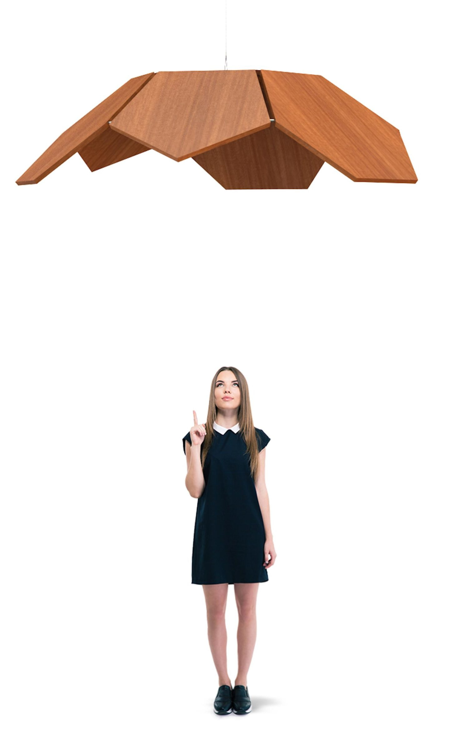 A woman standing under a wood acoustic panel