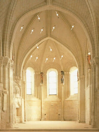 Holes in a cathedral ceiling for acoustic absorption.