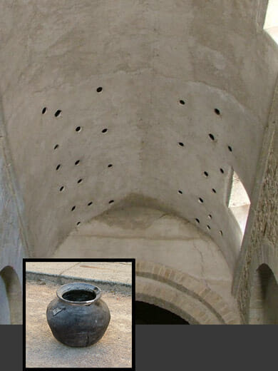 Jars built into an old ceiling for sound absorption.